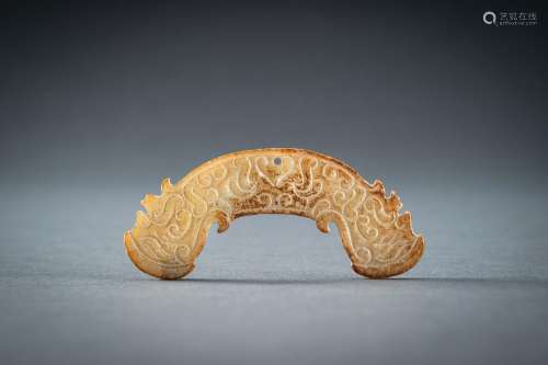 AN ARCHAISTIC PALE YELLOW JADE PENDANT, HUANG, QING