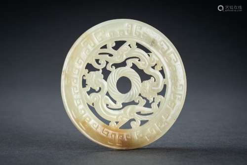 AN ARCHAISTIC YELLOW JADE RETICULATED ‘CHILONG’ BI DISC, QIN...