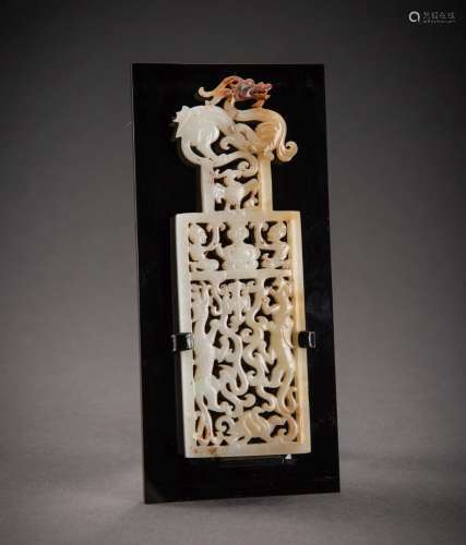 A FINE OPENWORK WHITE AND RUSSET JADE PLAQUE WITH THE ANIMAL...