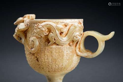 AN ARCHAISTIC CELADON JADE ‘CHILONG’ WINE CUP