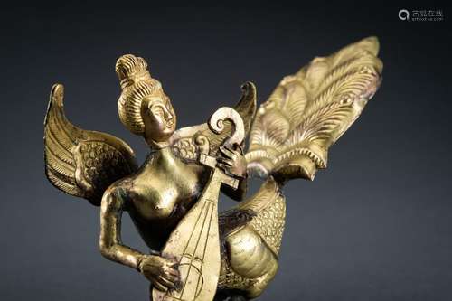 AN ARCHAISTIC FIRE-GILT COPPER REPOUSSÉ FIGURE OF APSARA