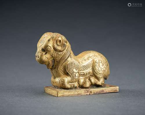 AN ARCHAISTIC FIRE-GILT COPPER REPOUSSÉ FIGURE OF A RAM