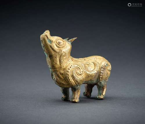 AN ARCHAISTIC FIRE-GILT COPPER REPOUSSÉ FIGURE OF A TAPIR