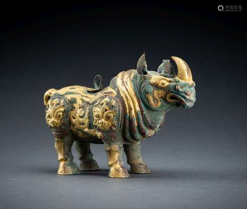 AN ARCHAISTIC FIRE-GILT COPPER REPOUSSÉ VESSEL OF A RHINOCER...