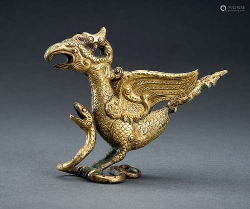 AN ARCHAISTIC FIRE-GILT COPPER REPOUSSÉ FIGURE OF A PHOENIX ...