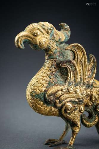 AN ARCHAISTIC FIRE-GILT COPPER REPOUSSÉ FIGURE OF A MYTHICAL...