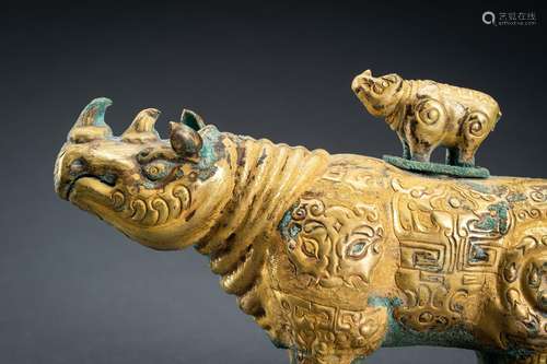 AN ARCHAISTIC FIRE-GILT COPPER REPOUSSÉ VESSEL OF A RHINOCER...