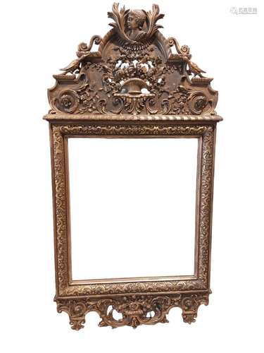 Grand miroir en bois sculpté doré style Louis XVI\nPoids: 25...