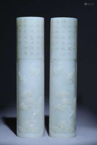 A pair of Hetian jade paperweights