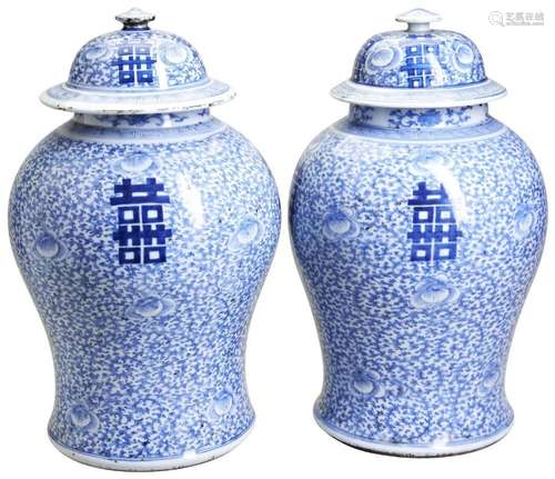 A PAIR OF LARGE BLUE AND WHITE COVERED JARS LATE QING DYNAST...