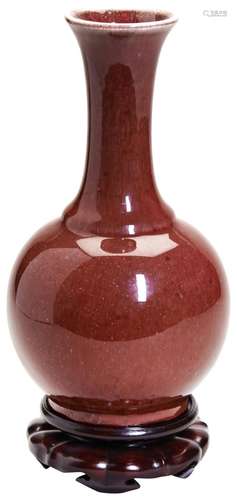 A FLAMBE RED-GLAZED BOTTLE VASE JIAQING / DAOGUANG PERIOD co...