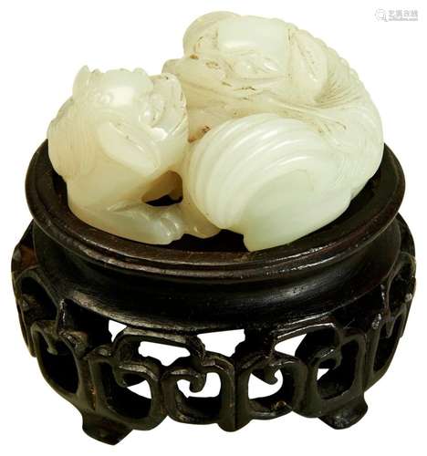 A CARVED WHITE JADE GROUP LATE QING DYNASTY modelled as two ...