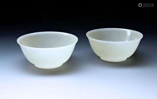 A FINE PAIR OF IMPERIAL WHITE JADE BOWLS QIANLONG FOUR CHARA...