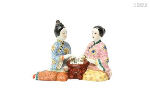 A CHINESE FAMILLE-ROSE FIGURE GROUP OF LADIES PLAYING WEIQI ...