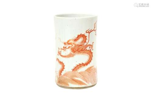 A CHINESE IRON-RED DECORATED 'DRAGON AND CARP' BRUSH POT, BI...