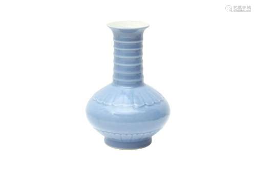 A CHINESE MONOCHROME BLUE-GLAZED 'PETAL' VASE 二十世紀 藍釉蓮...