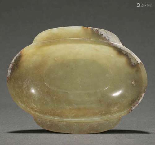 A CARVED JADE WASHER