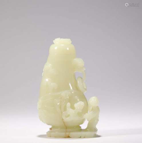 A CARVED WHITE JADE VASE AND COVER