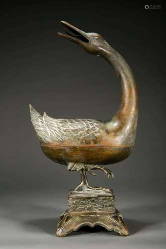 A BRONZE DUCK FORM BURNER