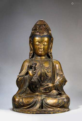 A GILT-BRONZE FIGURE OF SEATED GUANYIN