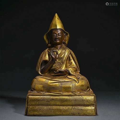 A GILT-BRONZE FIGURE OF TSONGKHAPA