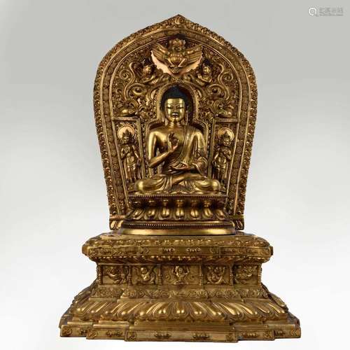 A GILT-BRONZE FIGURE OF SEATED SAKYAMUNI