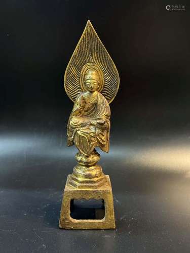 A GILT-BRONZE SEATED BUDDHA