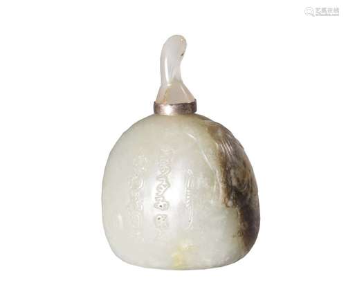 A CARVED WHITE JADE SNUFF BOTTLE