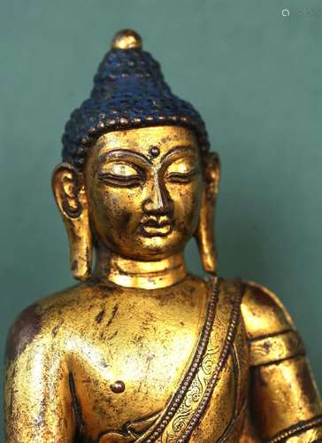 A GILT-BRONZE FIGURE OF SAKYAMUNI