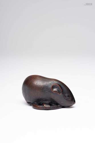 A JAPANESE WOOD NETSUKE OF A RAT MEIJI ERA, 19TH CENTURY The...