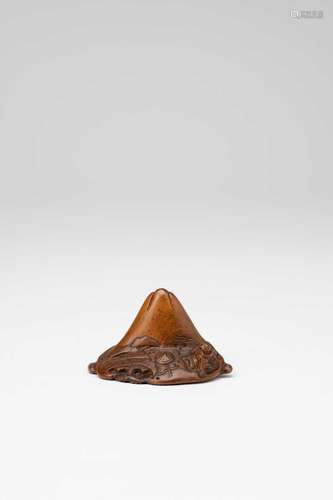 A JAPANESE WOOD NETSUKE EDO PERIOD, 19TH CENTURY Carved as S...