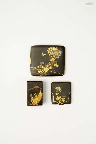 A JAPANESE DAMASCENE CIGARETTE CASE, MATCH STRIKER, AND MATC...