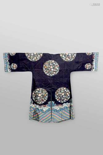 A CHINESE DARK BLUE-GROUND EMBROIDERED SILK ROBELATE QING DY...