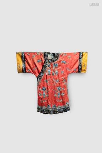 A CHINESE CORAL-GROUND EMBROIDERED SILK ROBE LATE QING DYNAS...