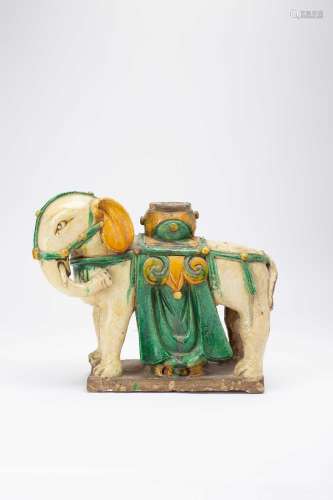 A CHINESE POTTERY MODEL OF AN ELEPHANTLATE MING DYNASTYStand...