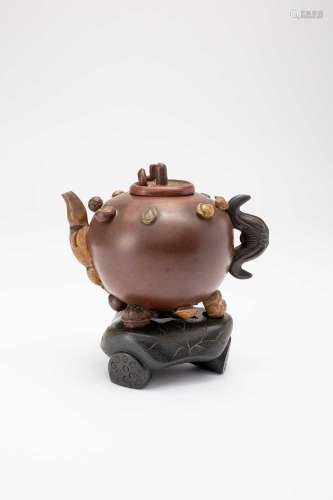 A CHINESE YIXING TEAPOT AND COVER 18TH/19TH CENTURYThe globu...