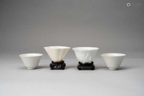 TWO CHINESE BLANC DE CHINE LIBATION CUPS AND A PAIR OF WHITE...