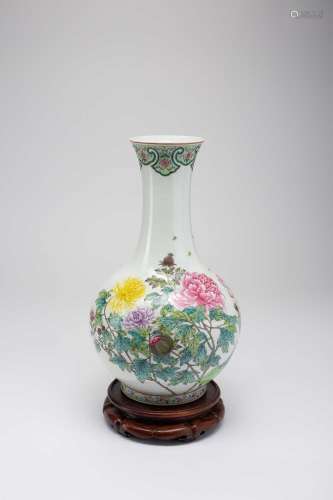 A CHINESE FAMILLE ROSE ‘FLOWERS OF THE FOUR SEASONS’ VASE20T...