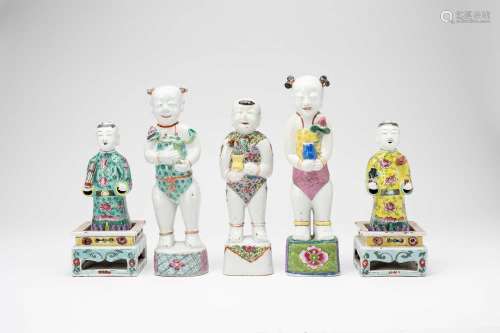 FIVE CHINESE FAMILLE ROSE MODELS OF STANDING BOYS AND TWO ST...