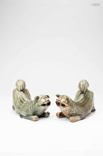 A PAIR OF CHINESE CELADON MODELS OF CROUCHING LION DOGSMING ...
