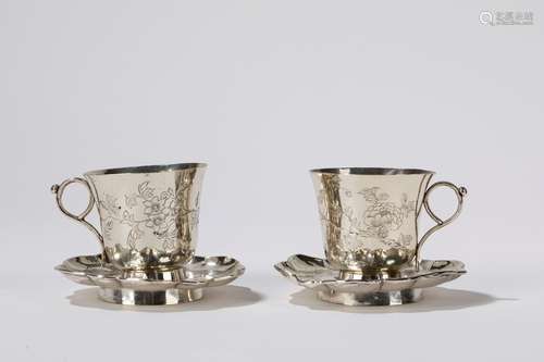 A pair of silver cups and saucers. China, 19th/20th c.