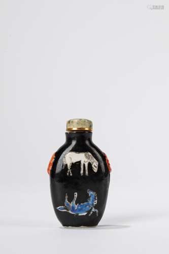 A black ground porcelain snuff bottle. China, late Qing dyna...