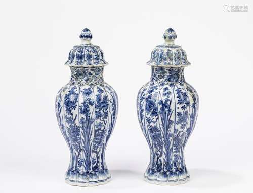 A pair of blue and white vases with covers. China, Kangxi Pe...