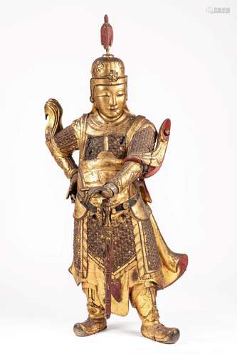 A large carved gilt wood standing figure of Wei Tuo. China, ...