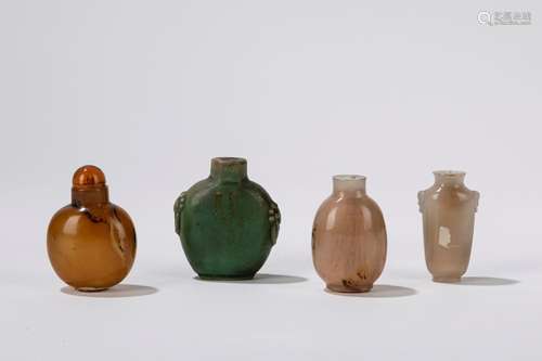 One porcelain and three agate snuff bottles. China, late 19t...