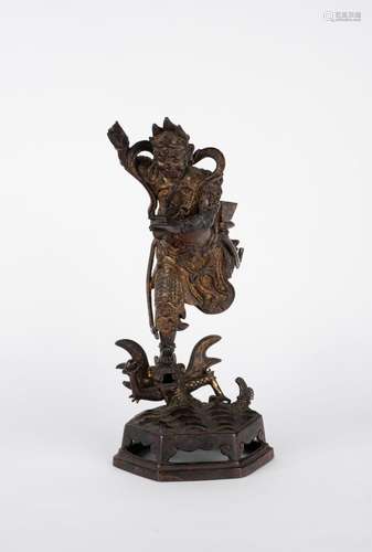 A gilt bronze deity. China, 17th c.