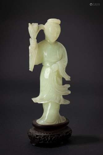 A green jade carving of a lady with flowers. China, 19th c.