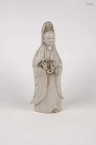 A white porcelain Guanyin with child. China, early 20th c.