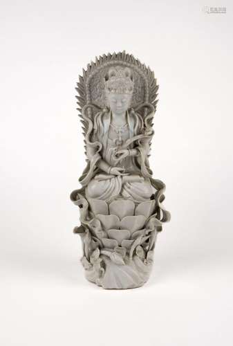 A Blanc de Chine seated Guanyin on lotus flower. China, Repu...