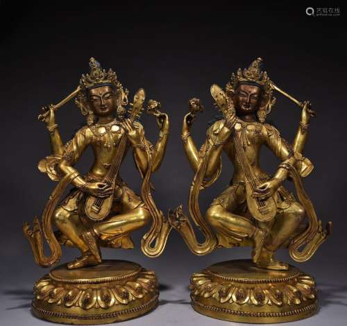 A pair of gilt-bronze statues of the Goddess Bodhisattva